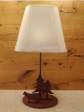 Lampe vache et sapins